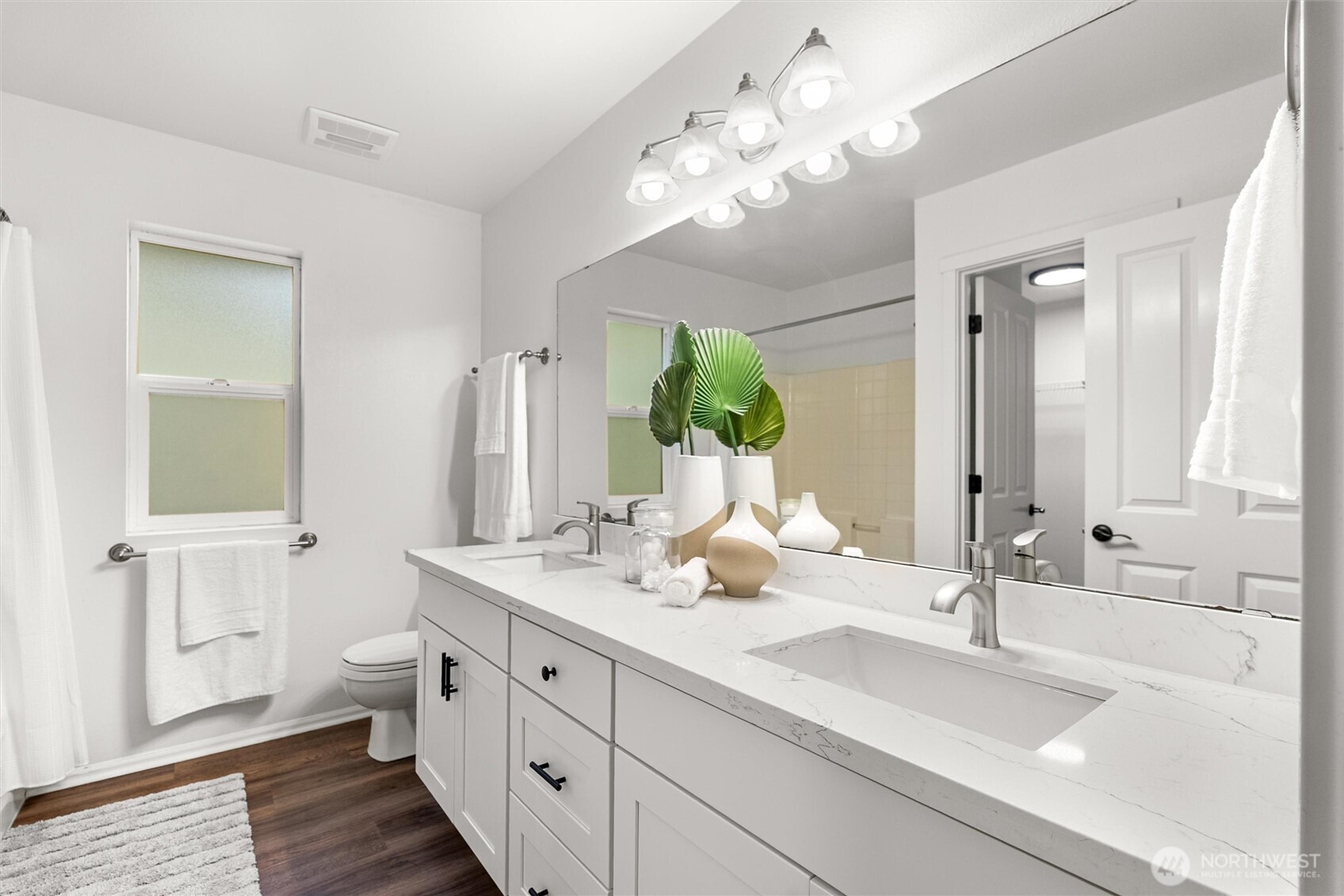 3957 South Chicago Street Seattle, WA 98118 - Photo 20 of 34 a bathroom with a double vanity sink mirror and toilet