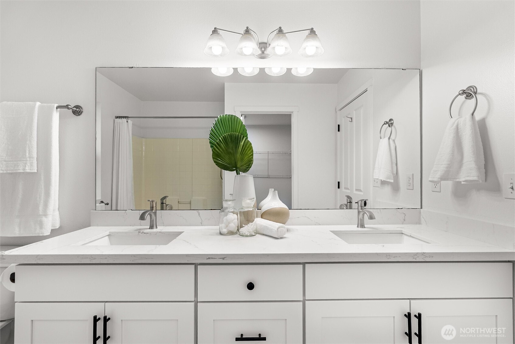 3957 South Chicago Street Seattle, WA 98118 - Photo 21 of 34 a bathroom with a sink double vanity and a mirror