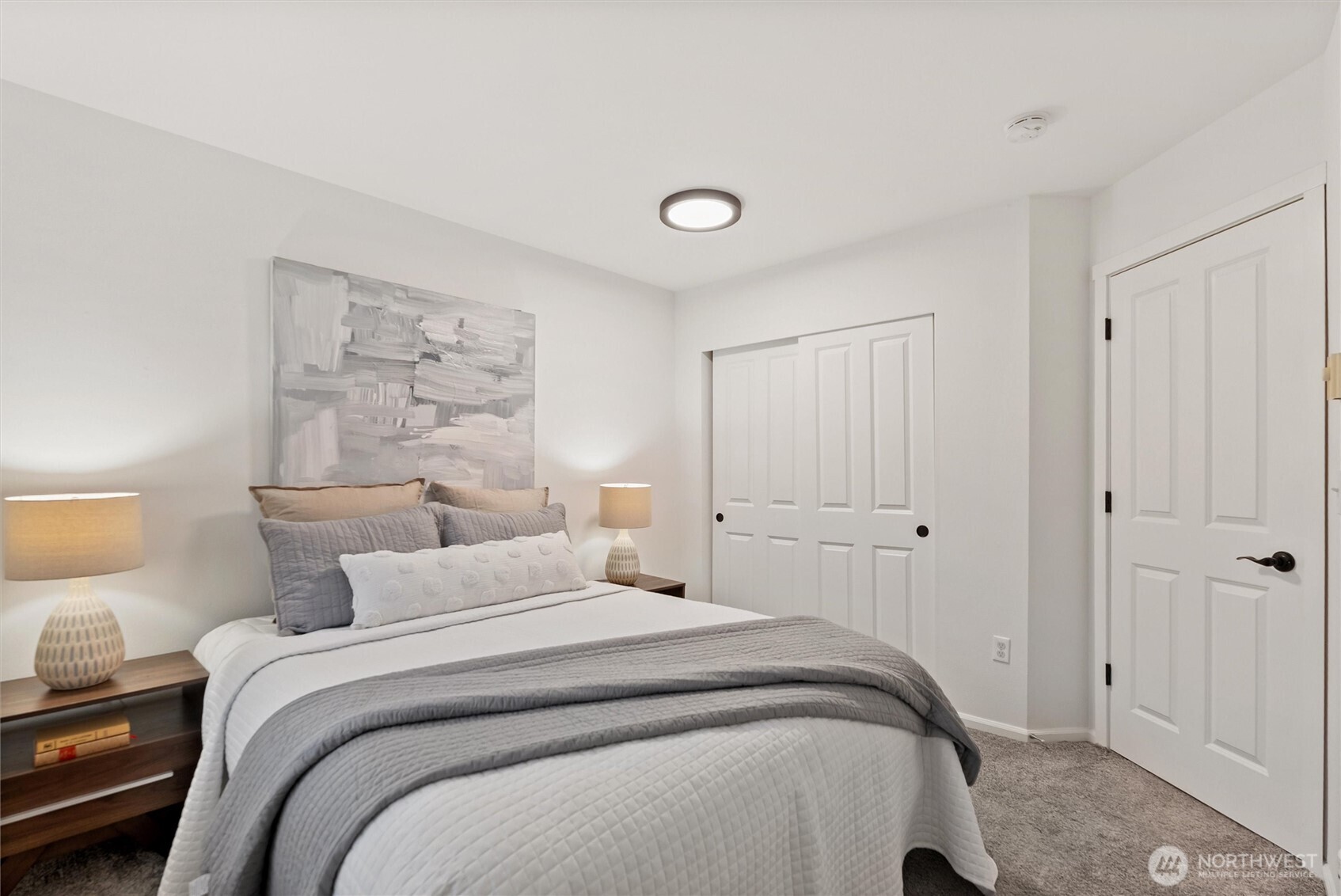 3957 South Chicago Street Seattle, WA 98118 - Photo 27 of 34 a bedroom with a bed and a lamp