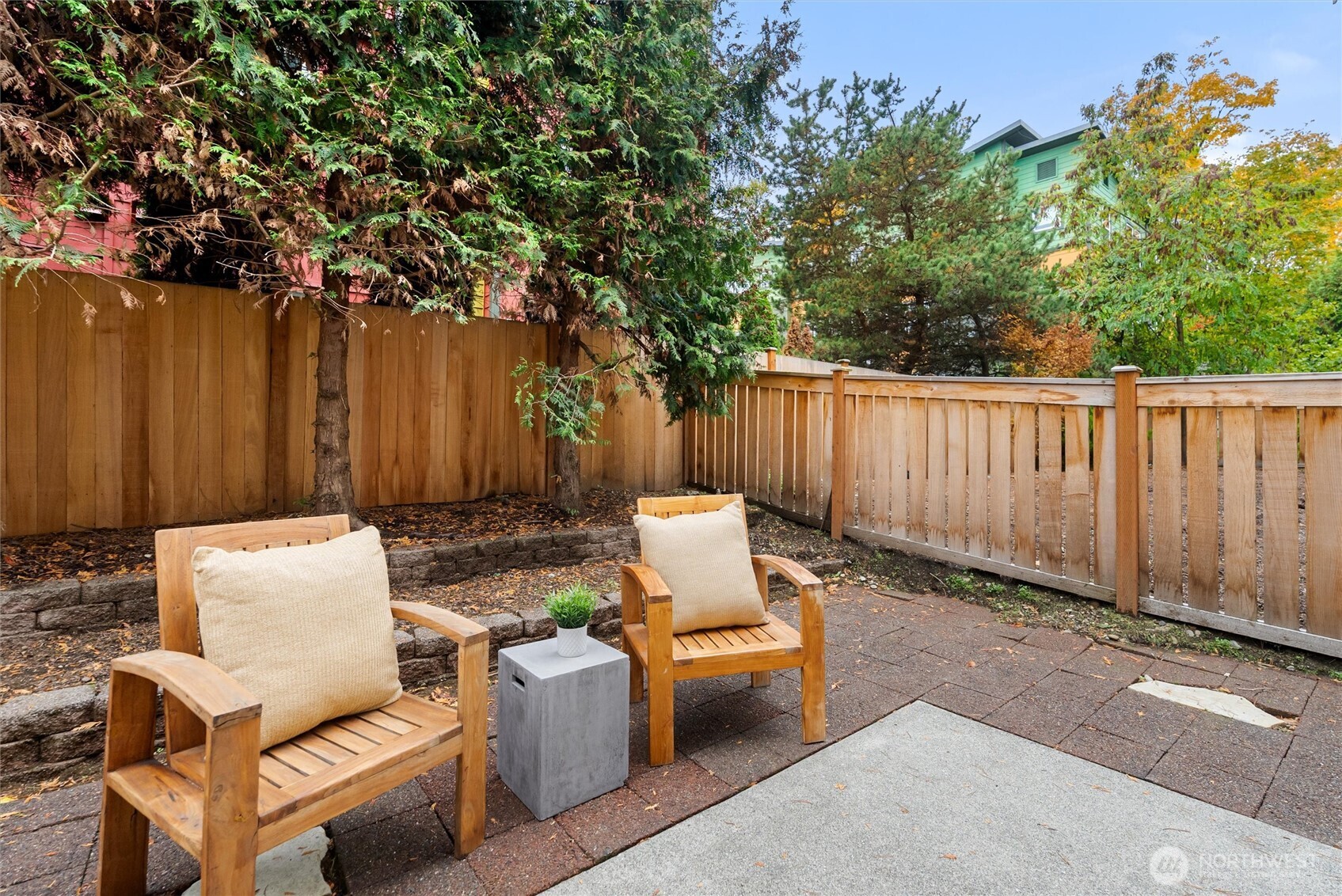 3957 South Chicago Street Seattle, WA 98118 - Photo 30 of 34 a backyard of a house with table and chairs