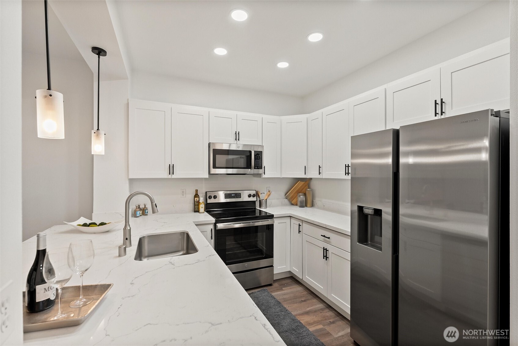 3957 South Chicago Street Seattle, WA 98118 - Photo 6 of 34 a kitchen with stainless steel appliances granite countertop a refrigerator sink and stove