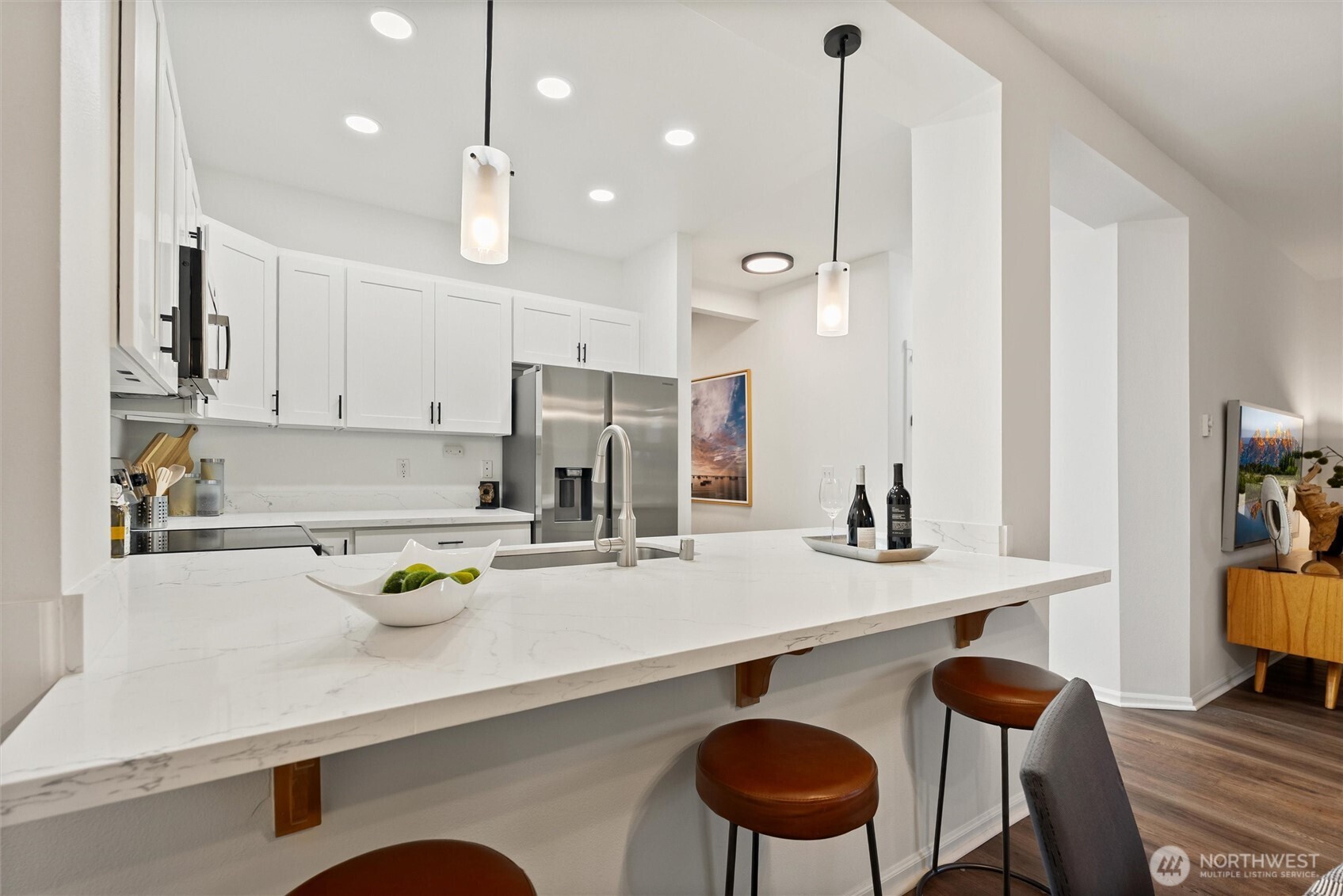 3957 South Chicago Street Seattle, WA 98118 - Photo 8 of 34 a kitchen with white cabinets and appliances