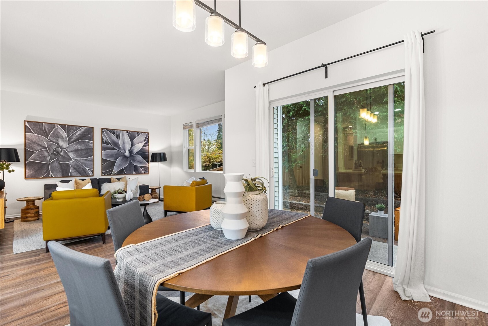 3957 South Chicago Street Seattle, WA 98118 - Photo 10 of 34 a dining room with furniture a large window and a chandelier