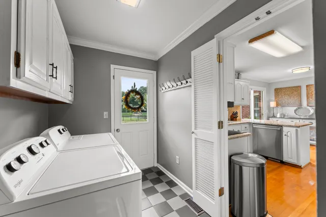 a kitchen with a refrigerator sink stove and cabinets