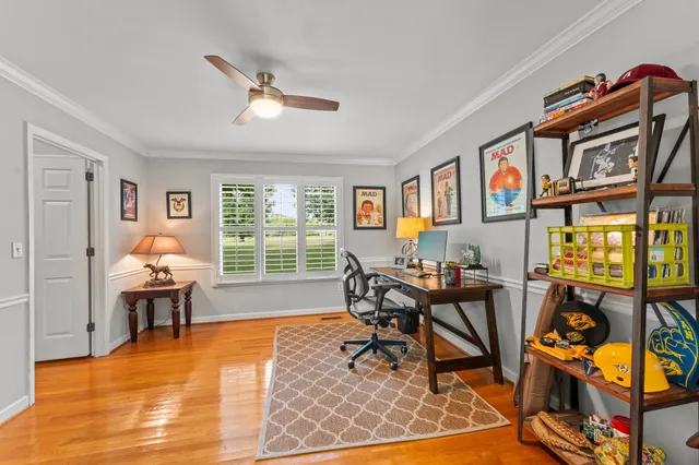 a work room with furniture and a window