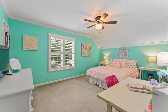 a bedroom with a bed and a table