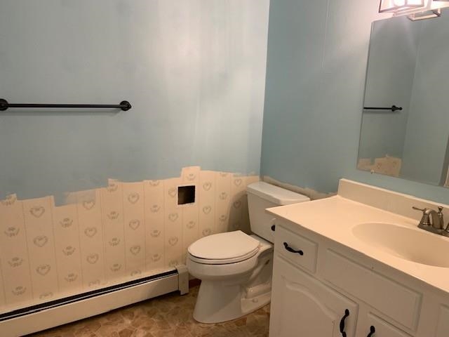 581-22 22 1/2 Road Grand Junction, CO 81507 - Photo 19 of 26 a white toilet sitting next to a bathroom sink