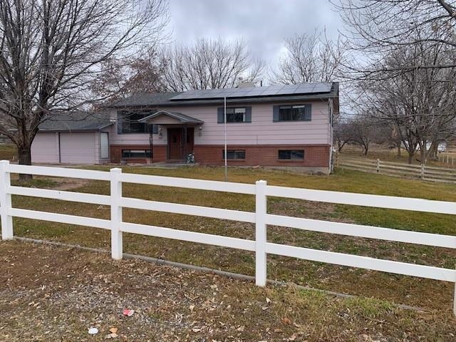 581-22 22 1/2 Road Grand Junction, CO 81507 - Photo 3 of 26 a front view of a house with a yard