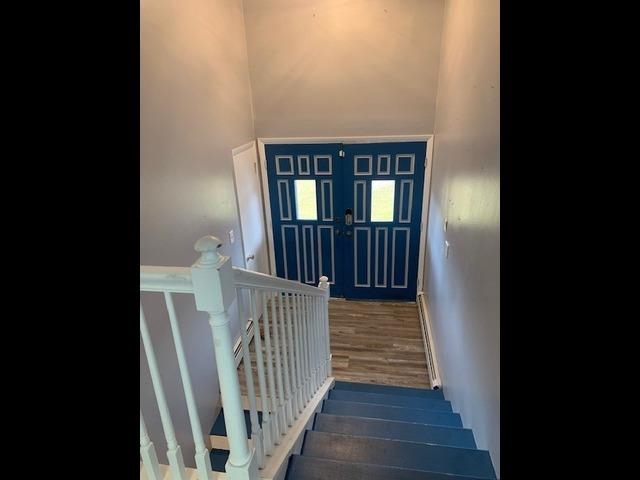 581-22 22 1/2 Road Grand Junction, CO 81507 - Photo 4 of 26 a view of a hallway with wooden floor and staircase