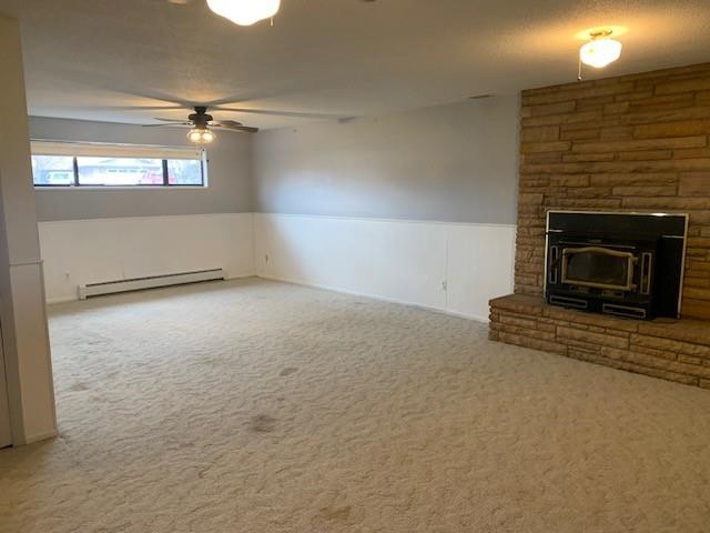 581-22 22 1/2 Road Grand Junction, CO 81507 - Photo 5 of 26 an empty room with windows and fireplace