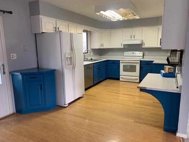 581-22 22 1/2 Road Grand Junction, CO 81507 - Photo 7 of 26 a kitchen with stainless steel appliances a refrigerator sink and wooden cabinets