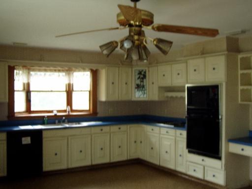 8905 North Grove Road Sycamore, IL 60178 - Photo 5 of 10 a kitchen with a sink a cabinets and window