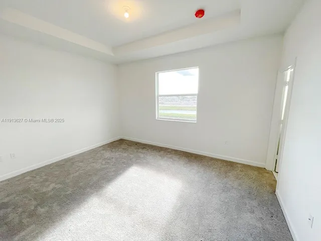 a view of a room that has a window