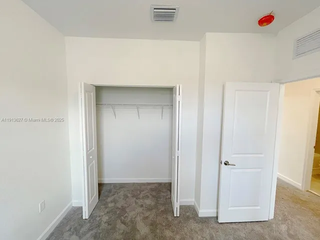 a view of small space with racks on the wall