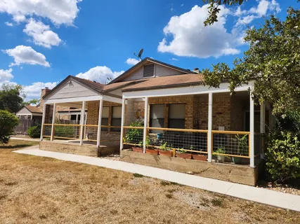a front view of a house with a large window