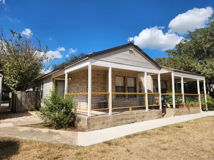 a house with trees in the background
