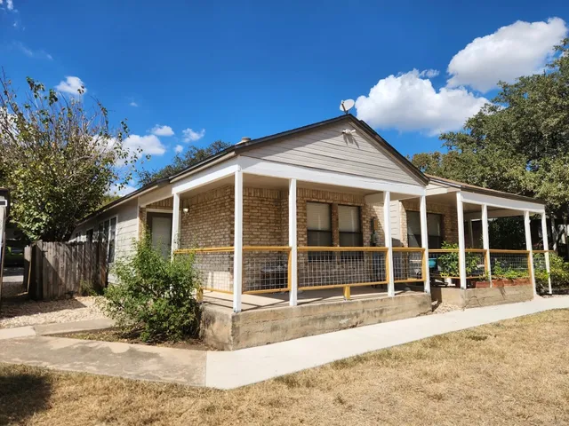 a house with trees in the background
