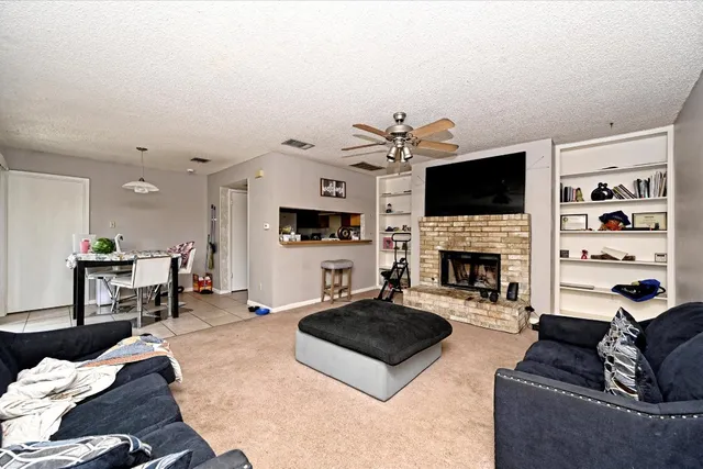 a kitchen with a refrigerator sink and cabinets