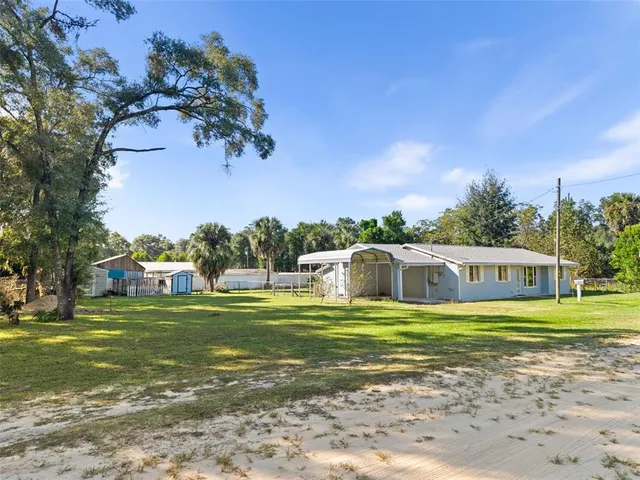 a view of a house with a big yard