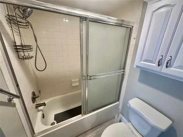 a spacious bathroom with a double vanity sink and a mirror