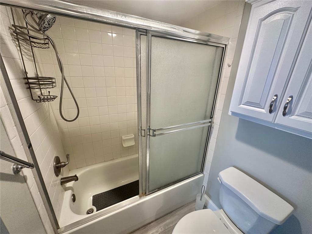 6009 Sea Ranch Drive, Unit 314 Hudson, FL 34667 - Photo 14 of 66 a bathroom with a shower a toilet and a shower