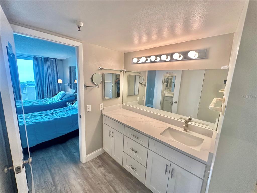 6009 Sea Ranch Drive, Unit 314 Hudson, FL 34667 - Photo 15 of 66 a spacious bathroom with a double vanity sink and a mirror