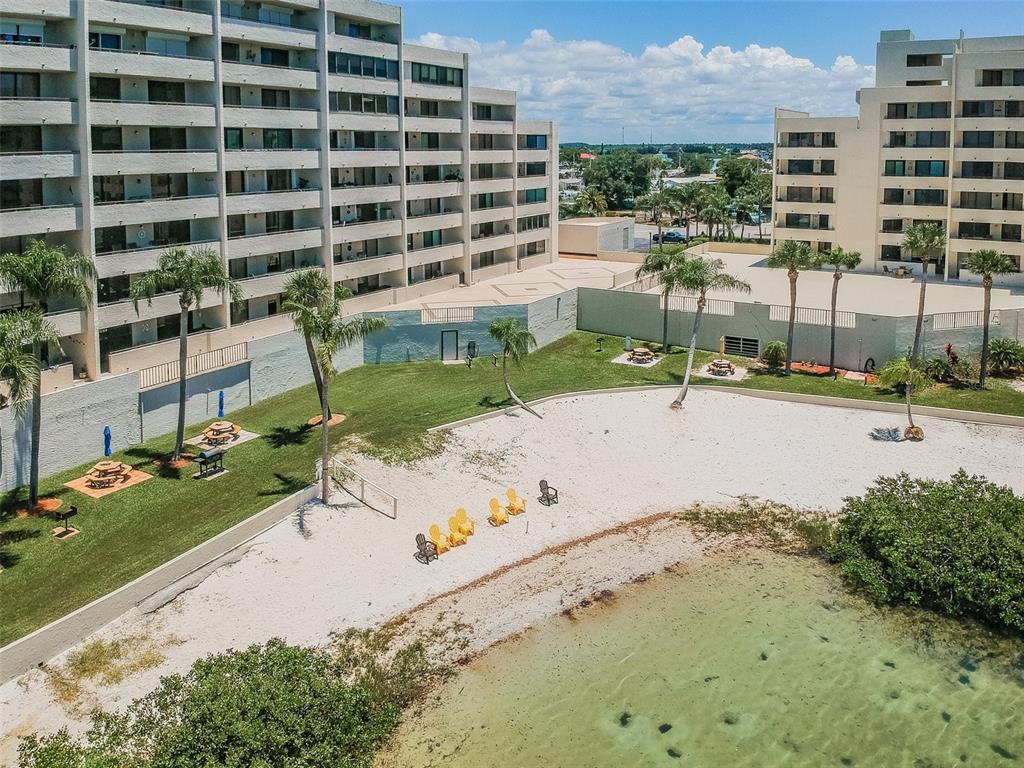 6009 Sea Ranch Drive, Unit 314 Hudson, FL 34667 - Photo 25 of 66 front view of a building with a yard