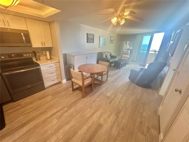 a living room with a couch and a stove top oven