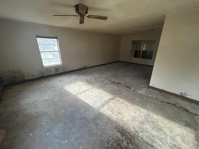 an empty room with windows