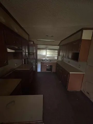 a kitchen with stainless steel appliances a refrigerator and a stove