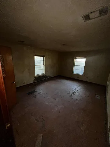a view of empty room with windows