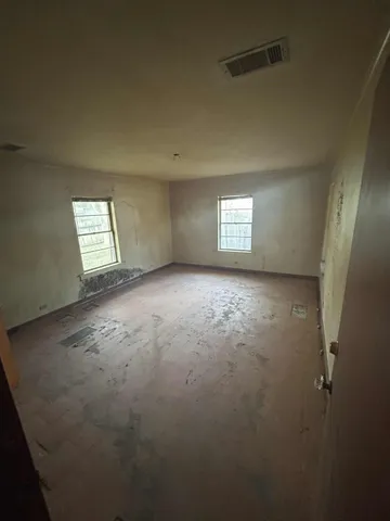 an empty room with windows