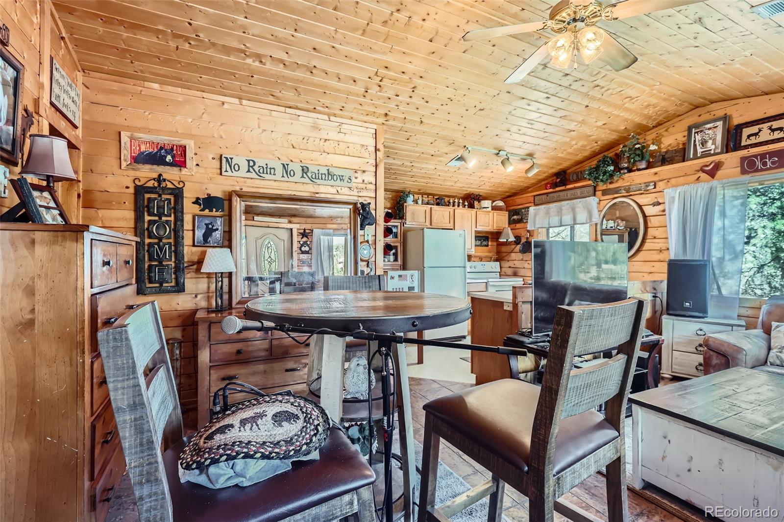 398 Gross Road Bailey, CO 80421 - Photo 16 of 28 a dining room with furniture and window