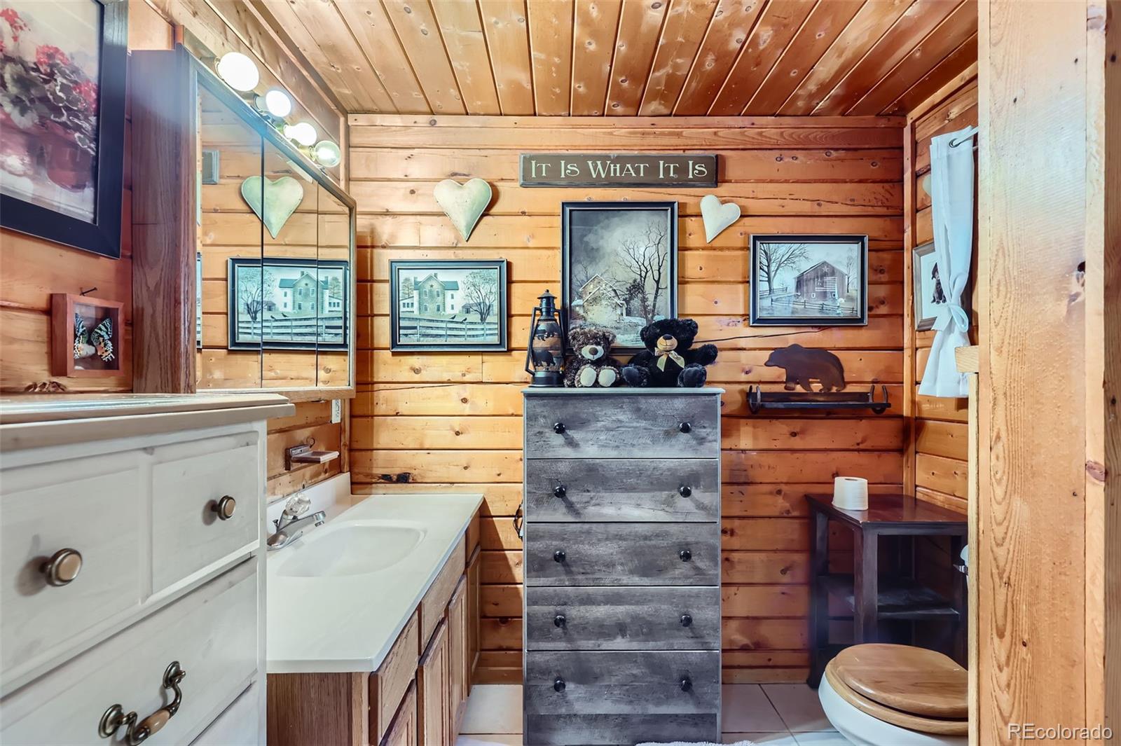 398 Gross Road Bailey, CO 80421 - Photo 22 of 28 a kitchen with a sink and wooden floor