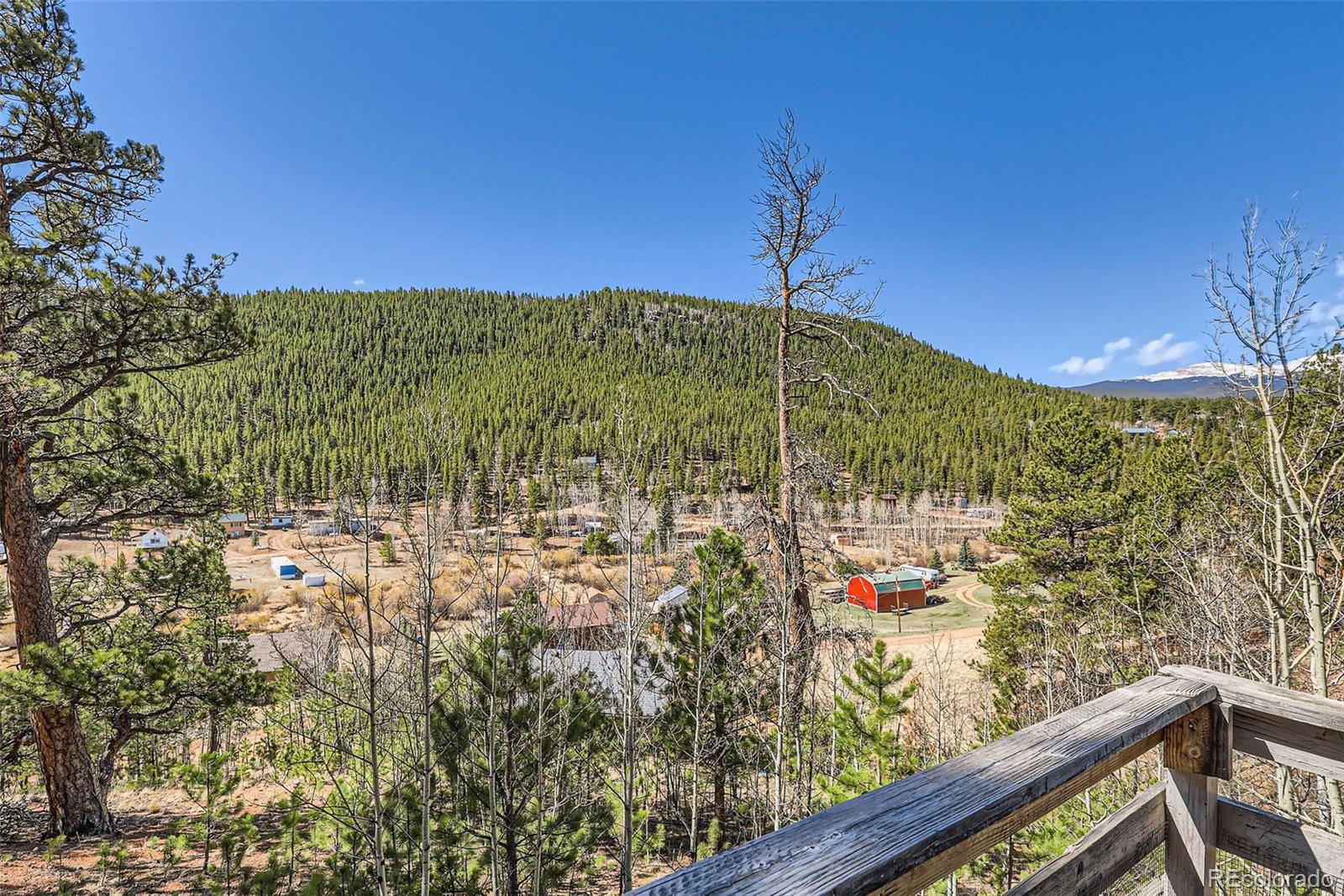 398 Gross Road Bailey, CO 80421 - Photo 26 of 28 a view of a building from a balcony