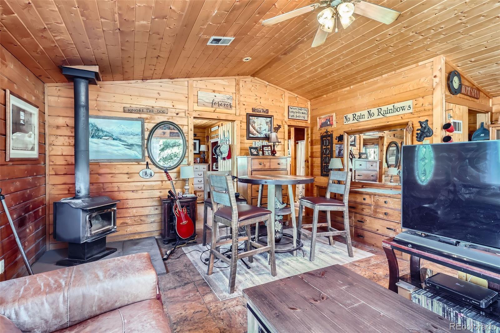 398 Gross Road Bailey, CO 80421 - Photo 7 of 28 a view of livingroom with dining room and wooden floor