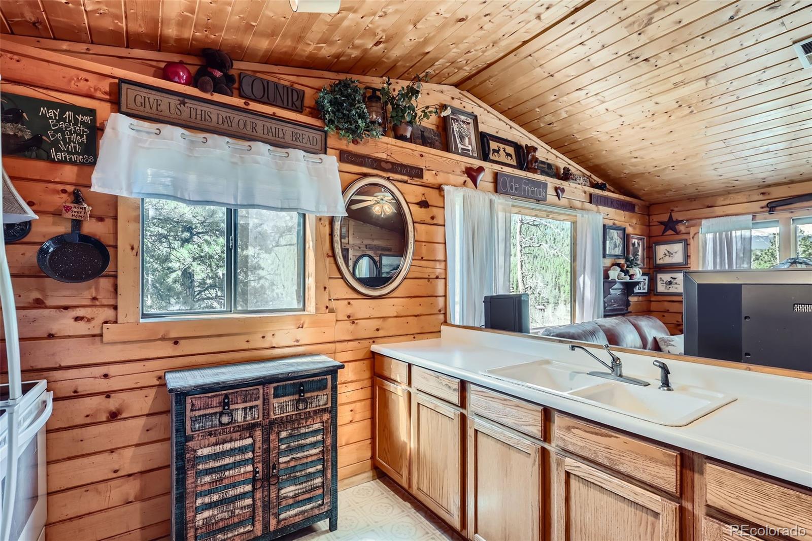 398 Gross Road Bailey, CO 80421 - Photo 10 of 28 a kitchen with a sink and a stove