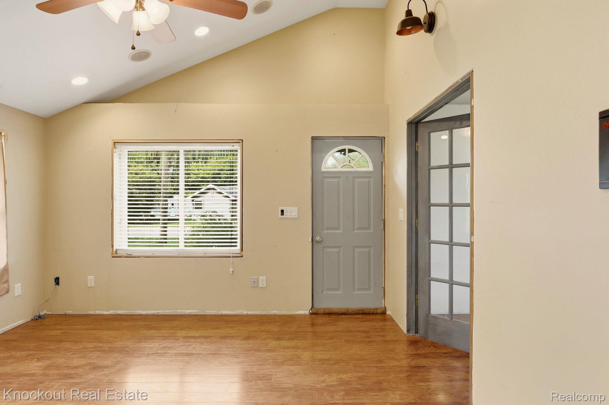 8811 Van Cleve Road Vassar, MI 48768 - Photo 5 of 39 Vaulted ceiling with recessed lighting and ceiling fan, wood-finish flooring, and a window with blinds