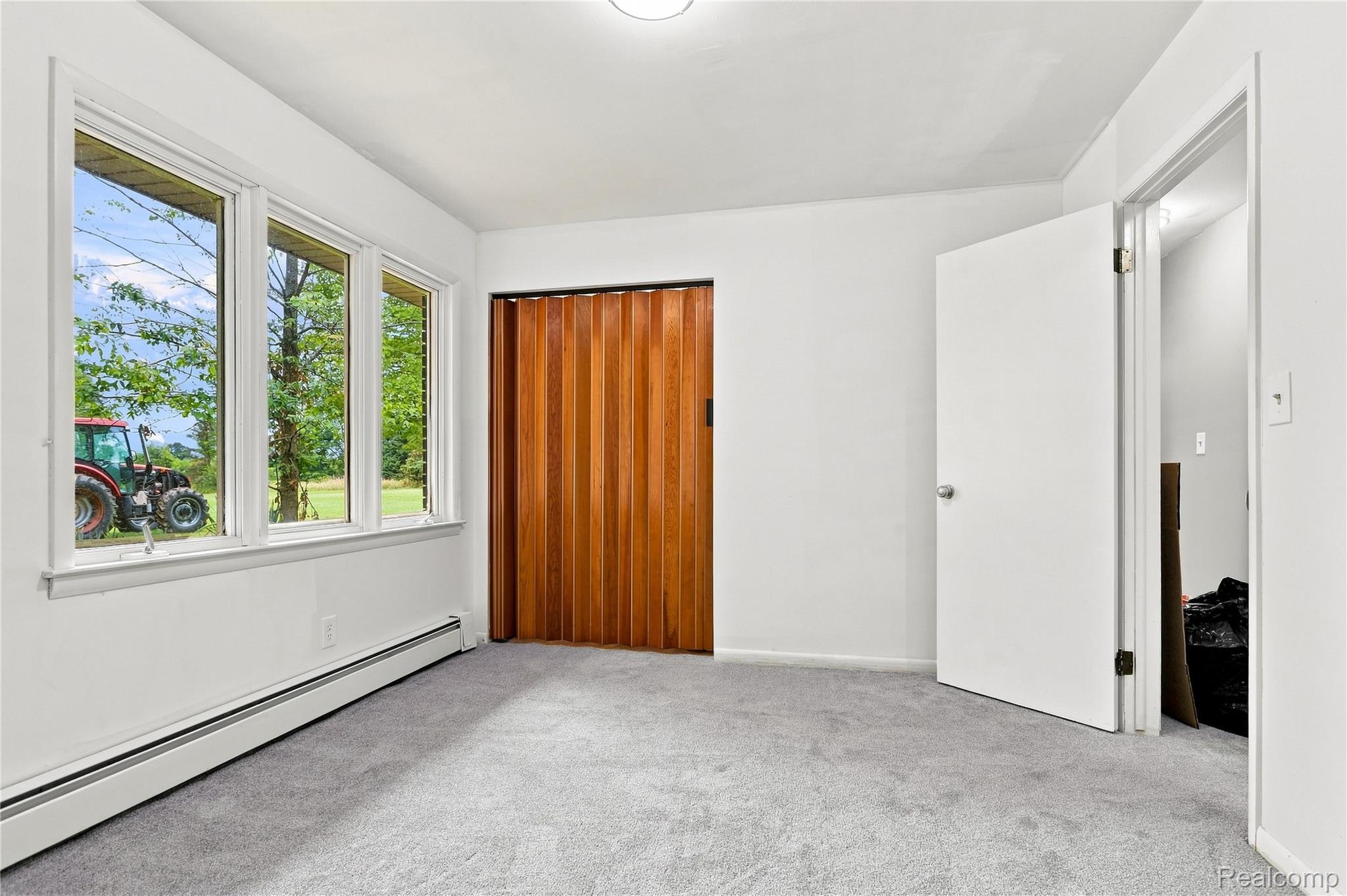7386 Dean Road Fenton, MI 48430 - Photo 46 of 64 White interior walls with a gray carpeted floor