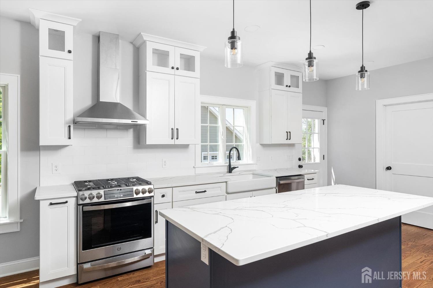 440 Ellisdale Road Chesterfield, NJ 08515 - Photo 12 of 42 a kitchen with stainless steel appliances a stove a sink and a refrigerator