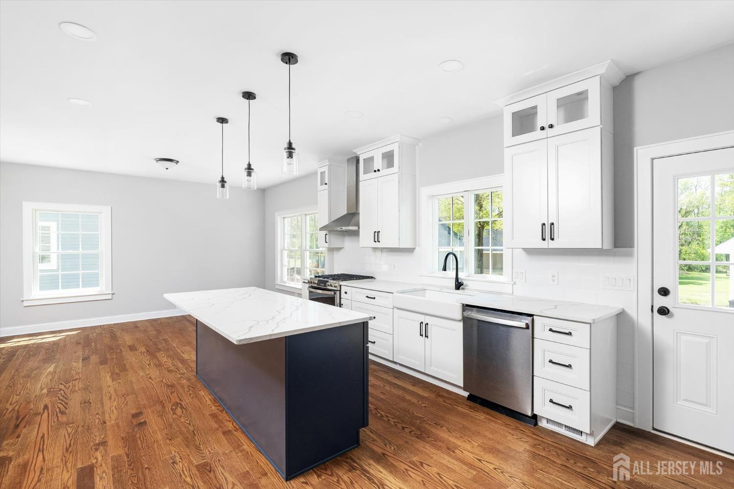 440 Ellisdale Road Chesterfield, NJ 08515 - Photo 14 of 42 a kitchen with white cabinets sink and white appliances