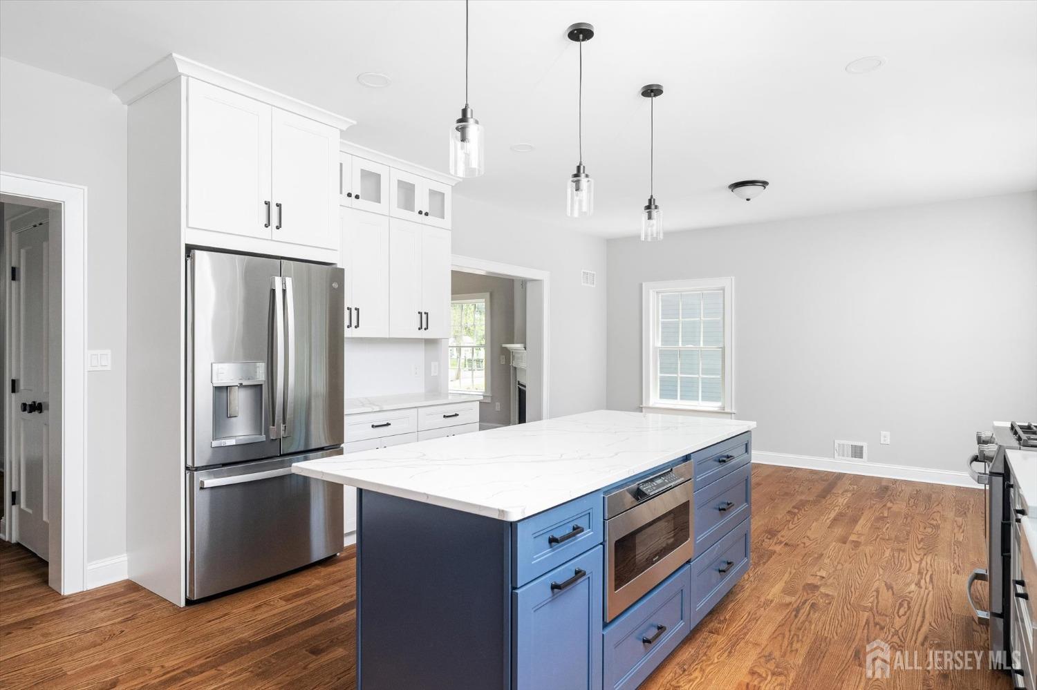 440 Ellisdale Road Chesterfield, NJ 08515 - Photo 16 of 42 a kitchen with a stove a sink and a refrigerator
