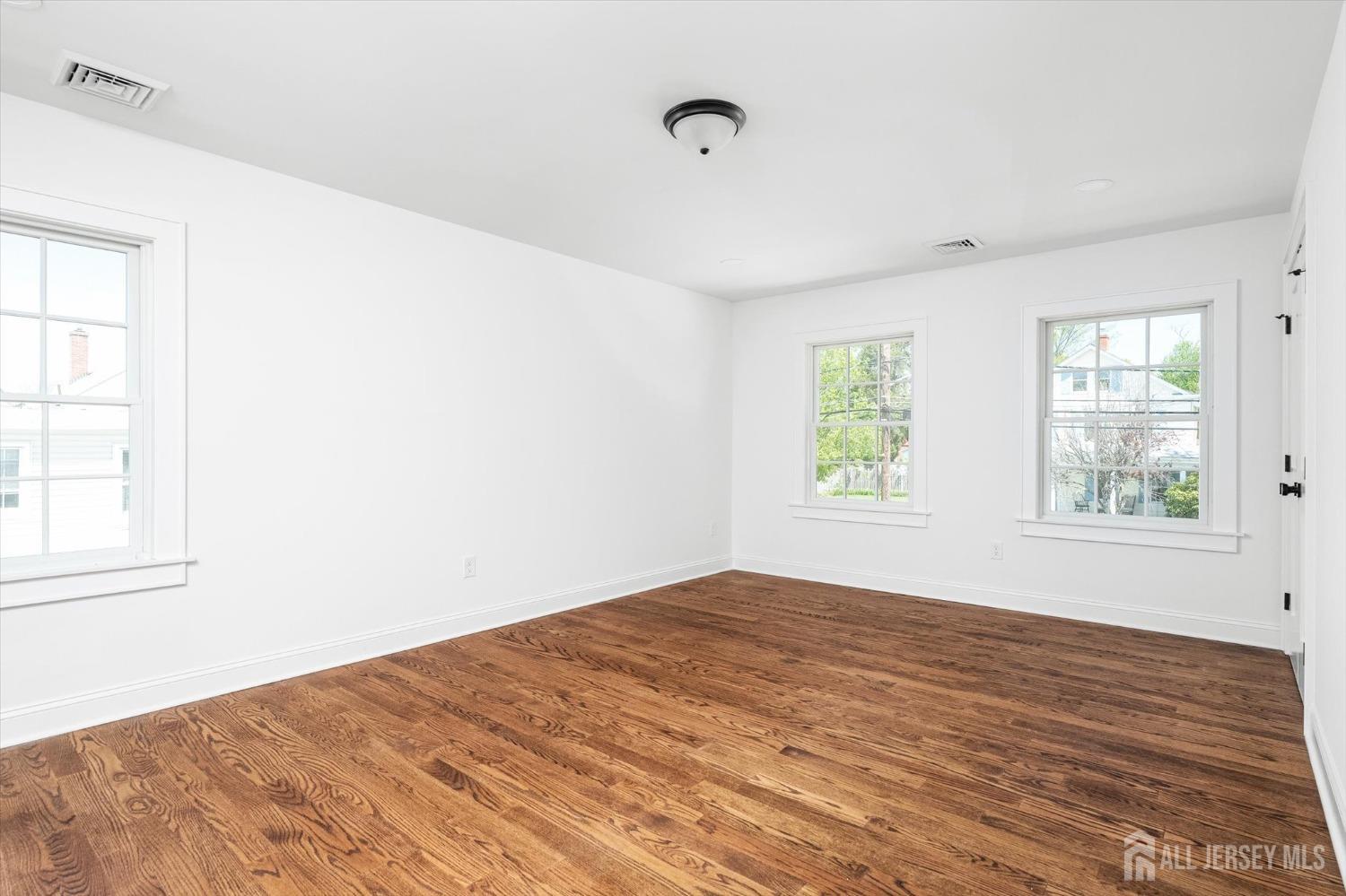 440 Ellisdale Road Chesterfield, NJ 08515 - Photo 19 of 42 a view of empty room with wooden floor and fan