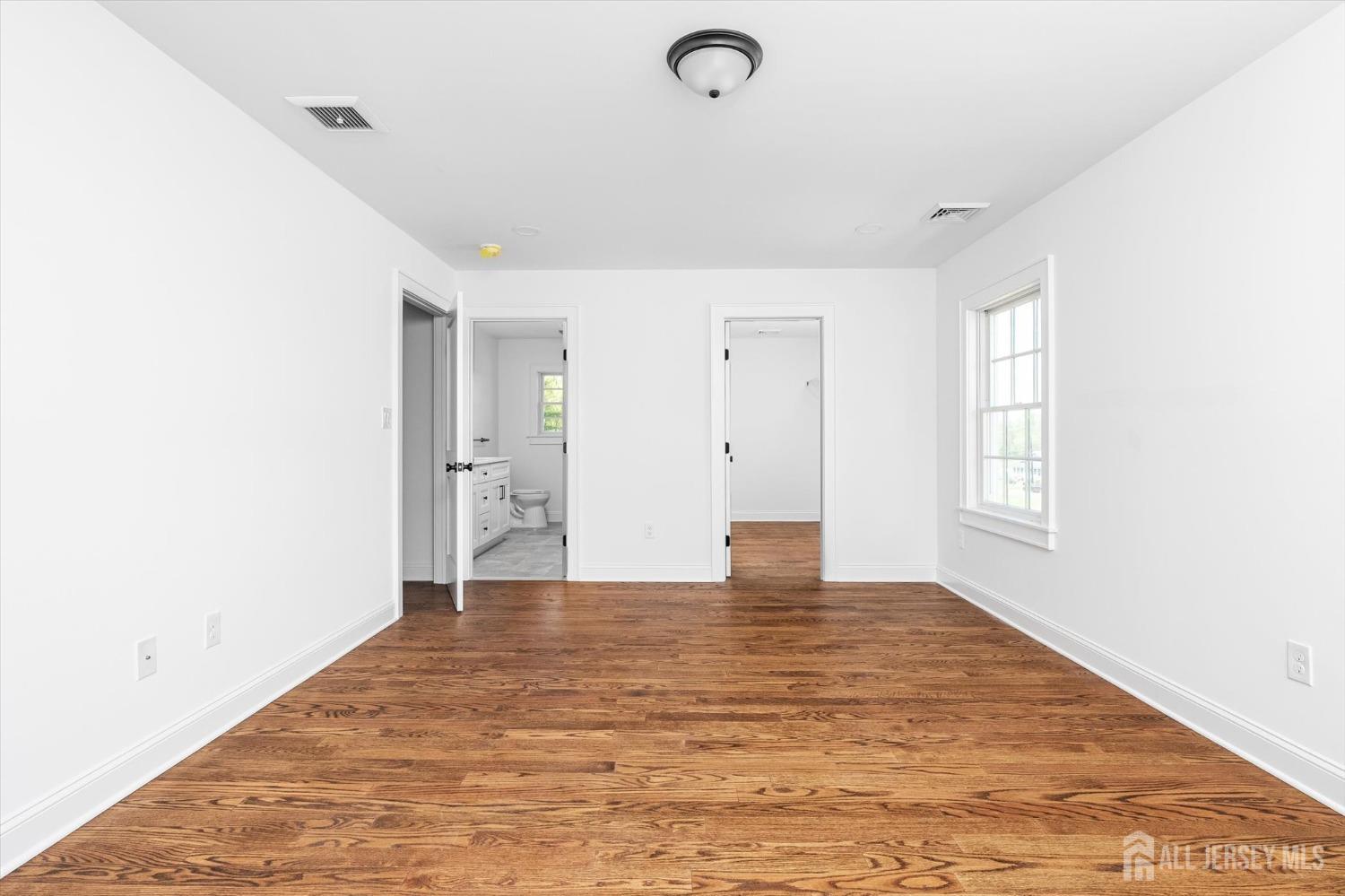 440 Ellisdale Road Chesterfield, NJ 08515 - Photo 20 of 42 a view of an empty room with window and wooden floor