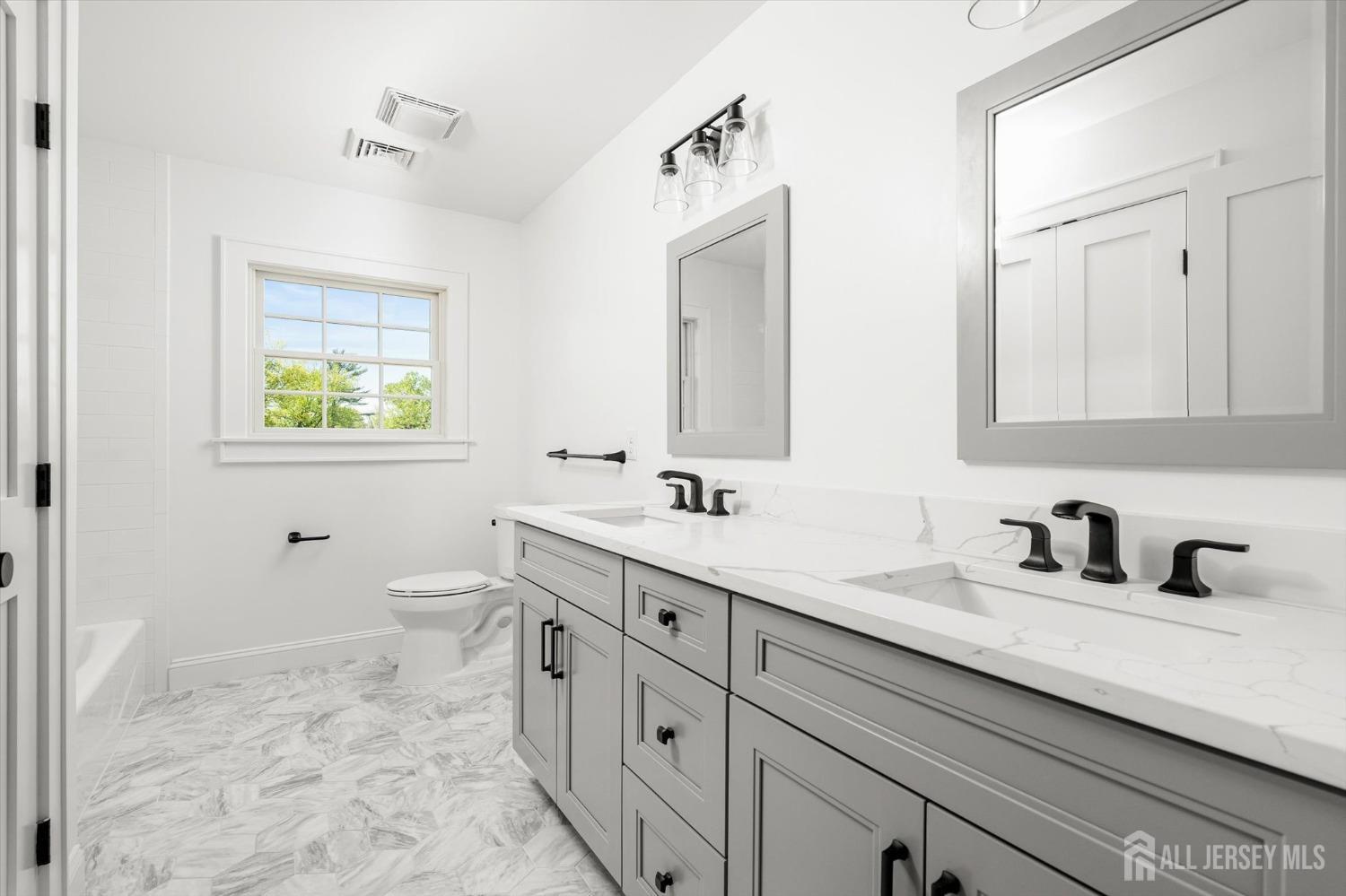 440 Ellisdale Road Chesterfield, NJ 08515 - Photo 24 of 42 a bathroom with a toilet sink and mirror