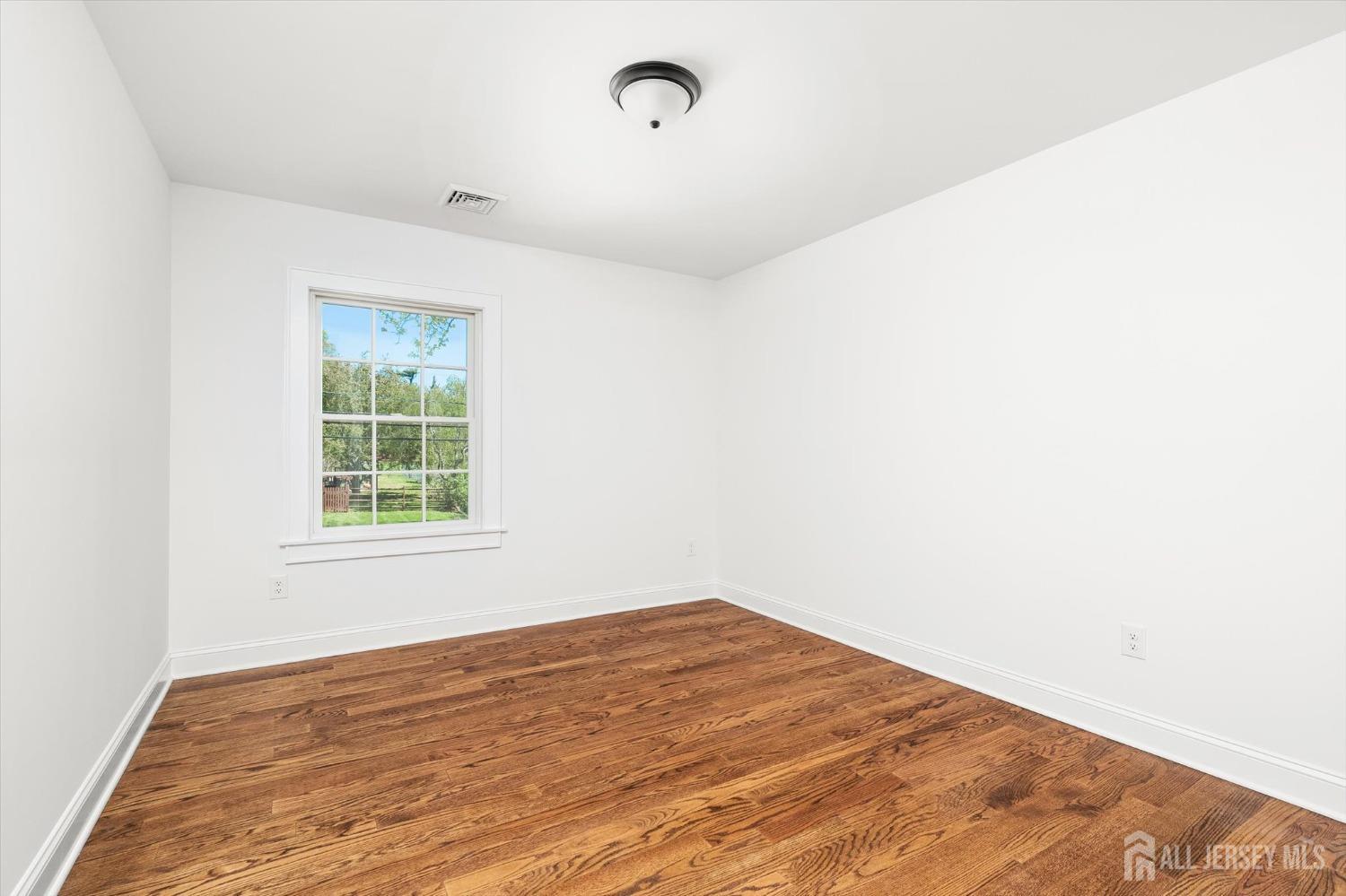 440 Ellisdale Road Chesterfield, NJ 08515 - Photo 29 of 42 a view of empty room with wooden floor