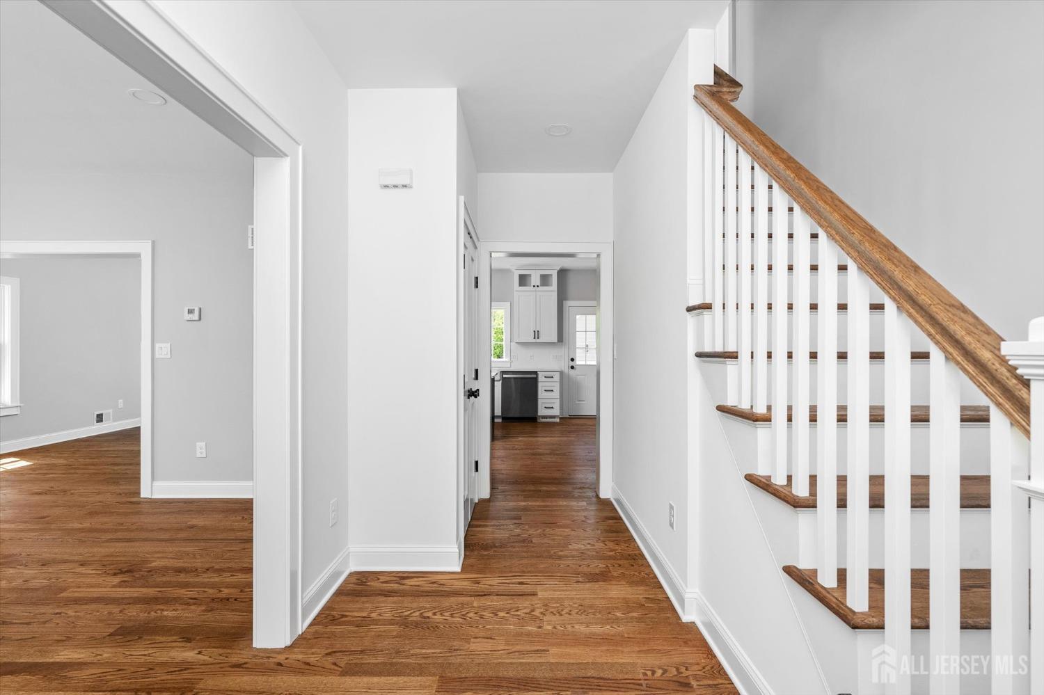 440 Ellisdale Road Chesterfield, NJ 08515 - Photo 3 of 42 a view of a hallway with wooden floor and staircase
