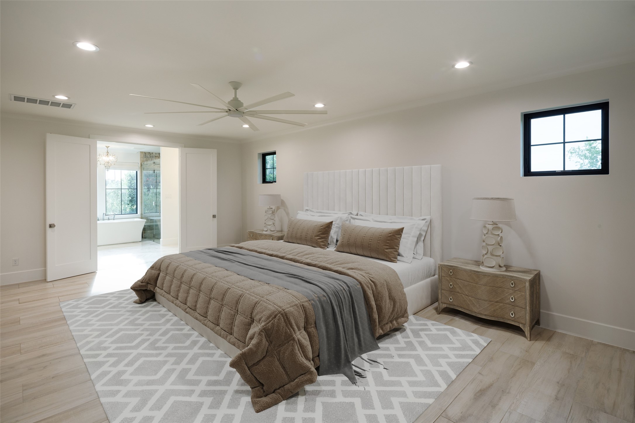 24118 Margerstadt Road Hockley, TX 77447 - Photo 19 of 46 The primary suite combines elevated ceilings, generous scale, and direct access to the screened outdoor living areas just beyond. Positioned within its own wing of the home, the space balances privacy with uninterrupted pasture views.