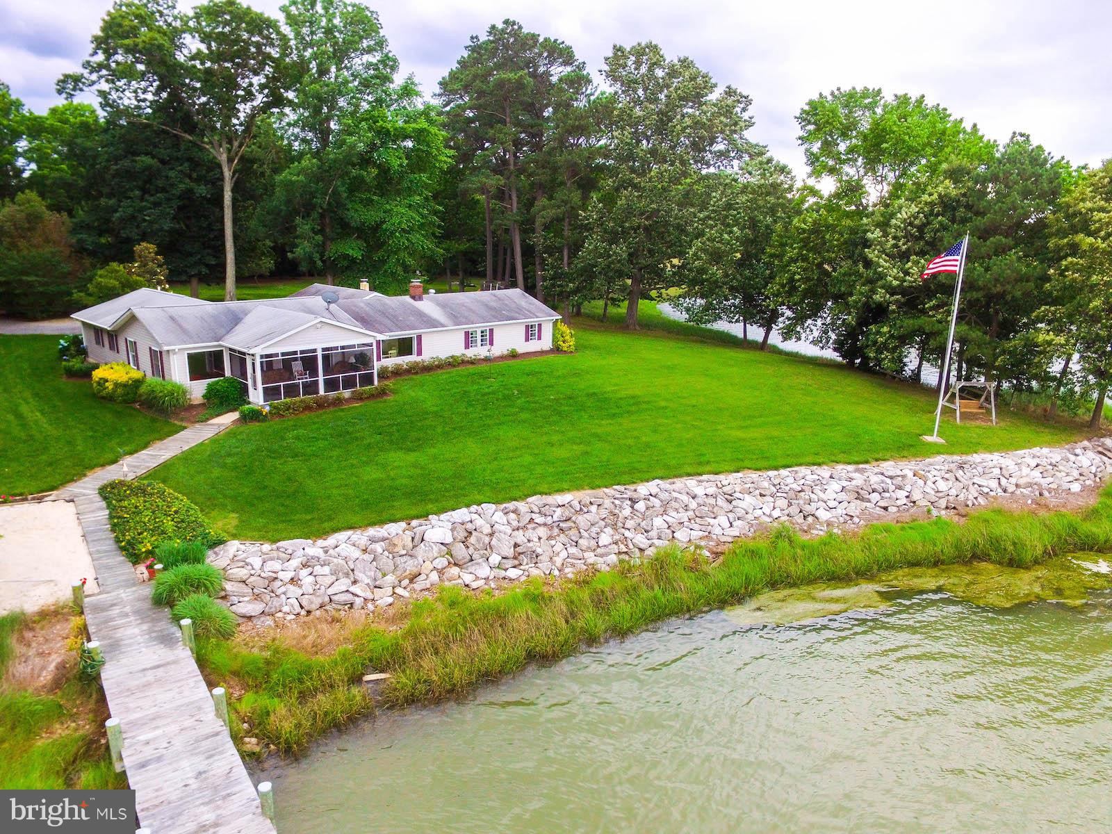 16215 Osprey Cove Ln Ridge Ridge, MD 20680 - Photo 1 of 30 a view of yard with swimming pool and green space