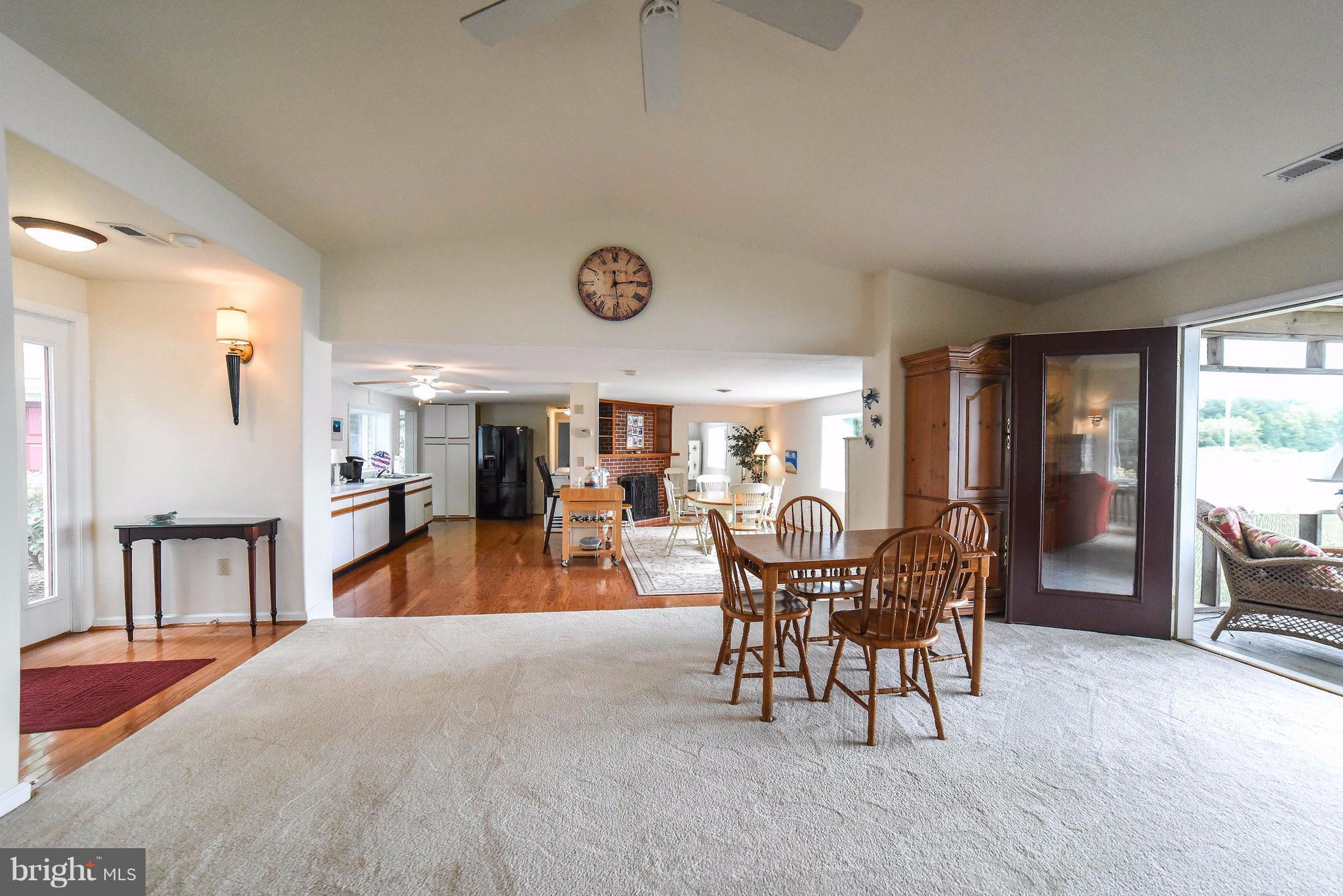 16215 Osprey Cove Ln Ridge Ridge, MD 20680 - Photo 18 of 30 a dining room with furniture and wooden floor